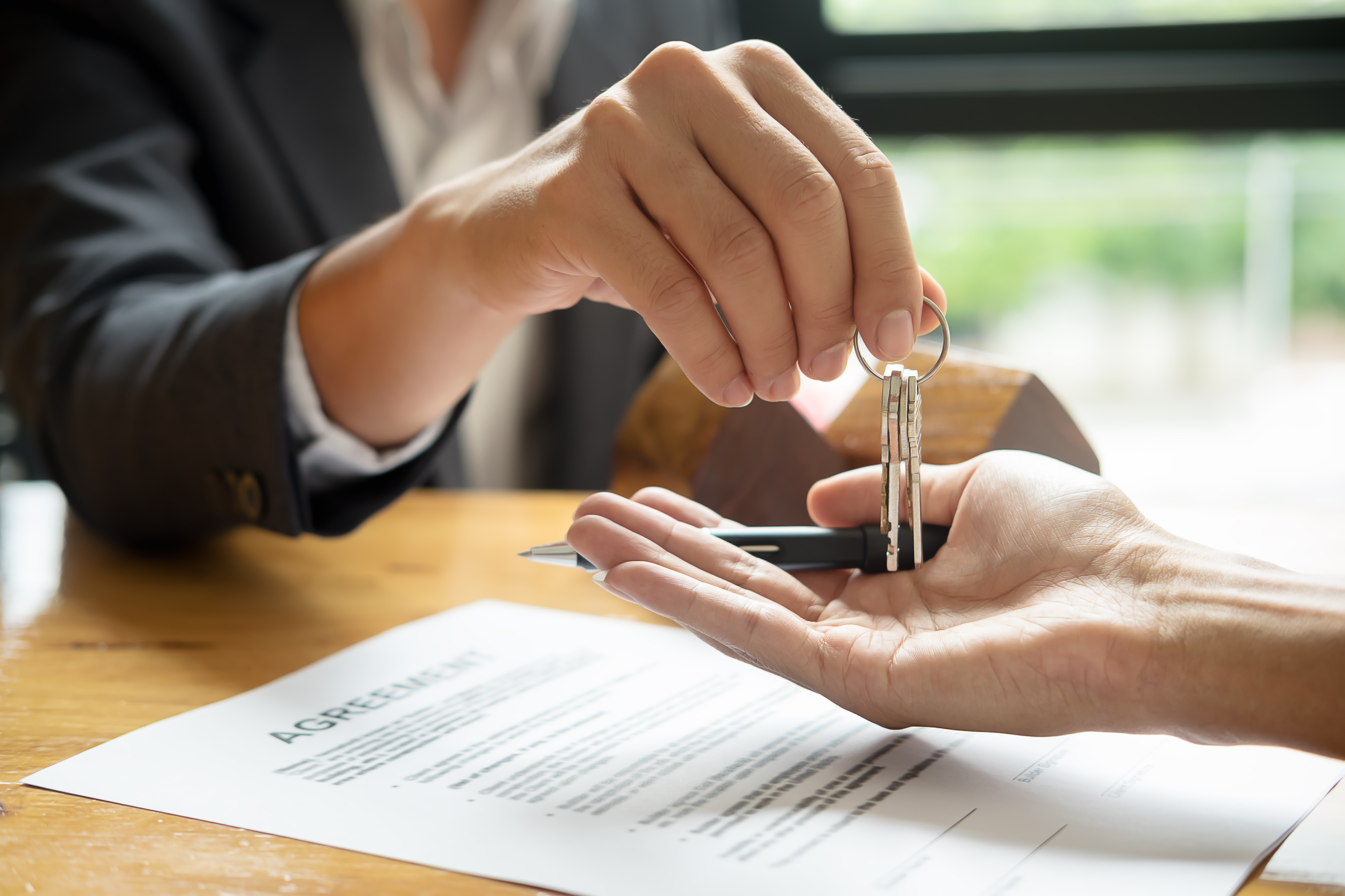 Real estate agent handing over keys