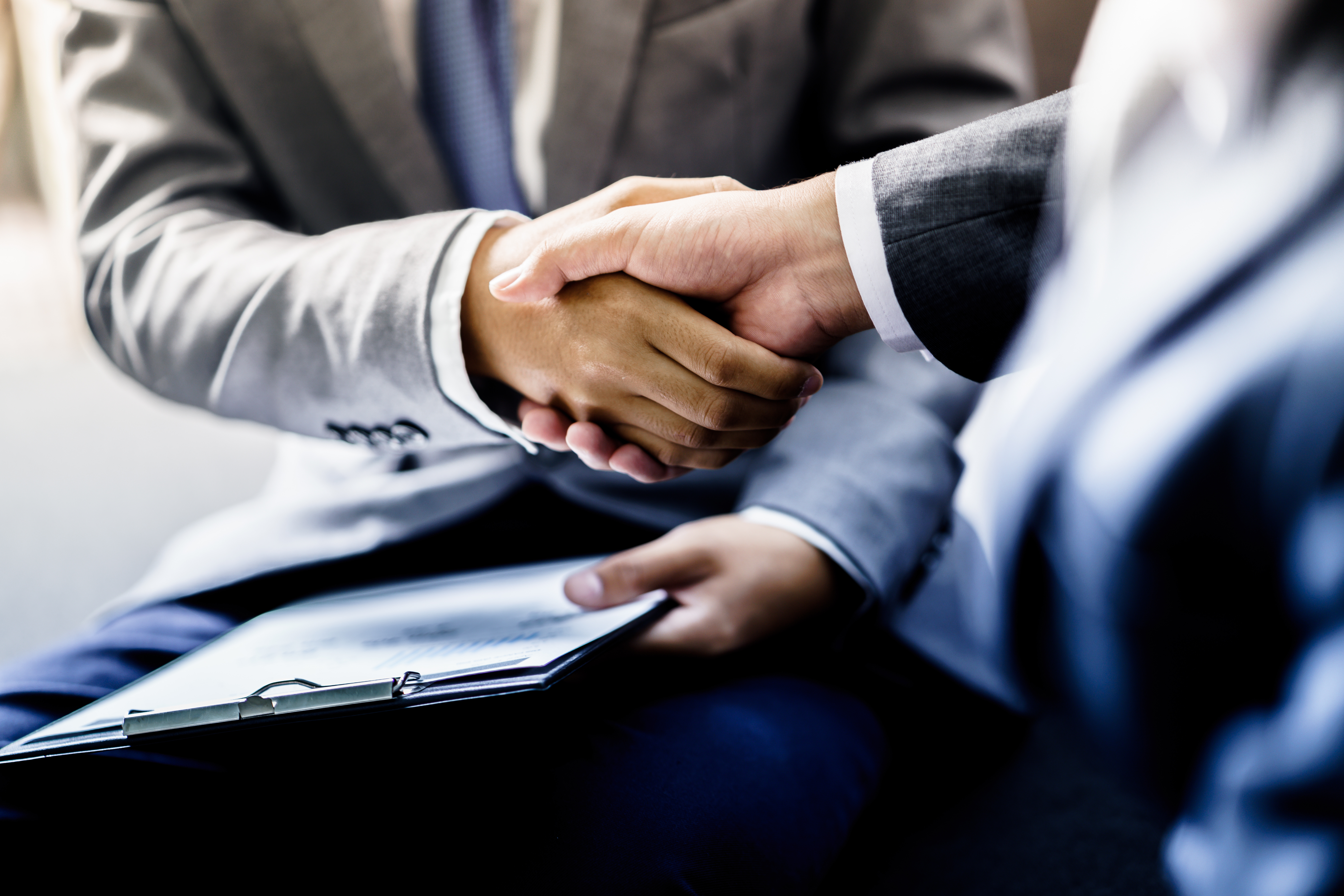 Businessman shaking hands with another businessman